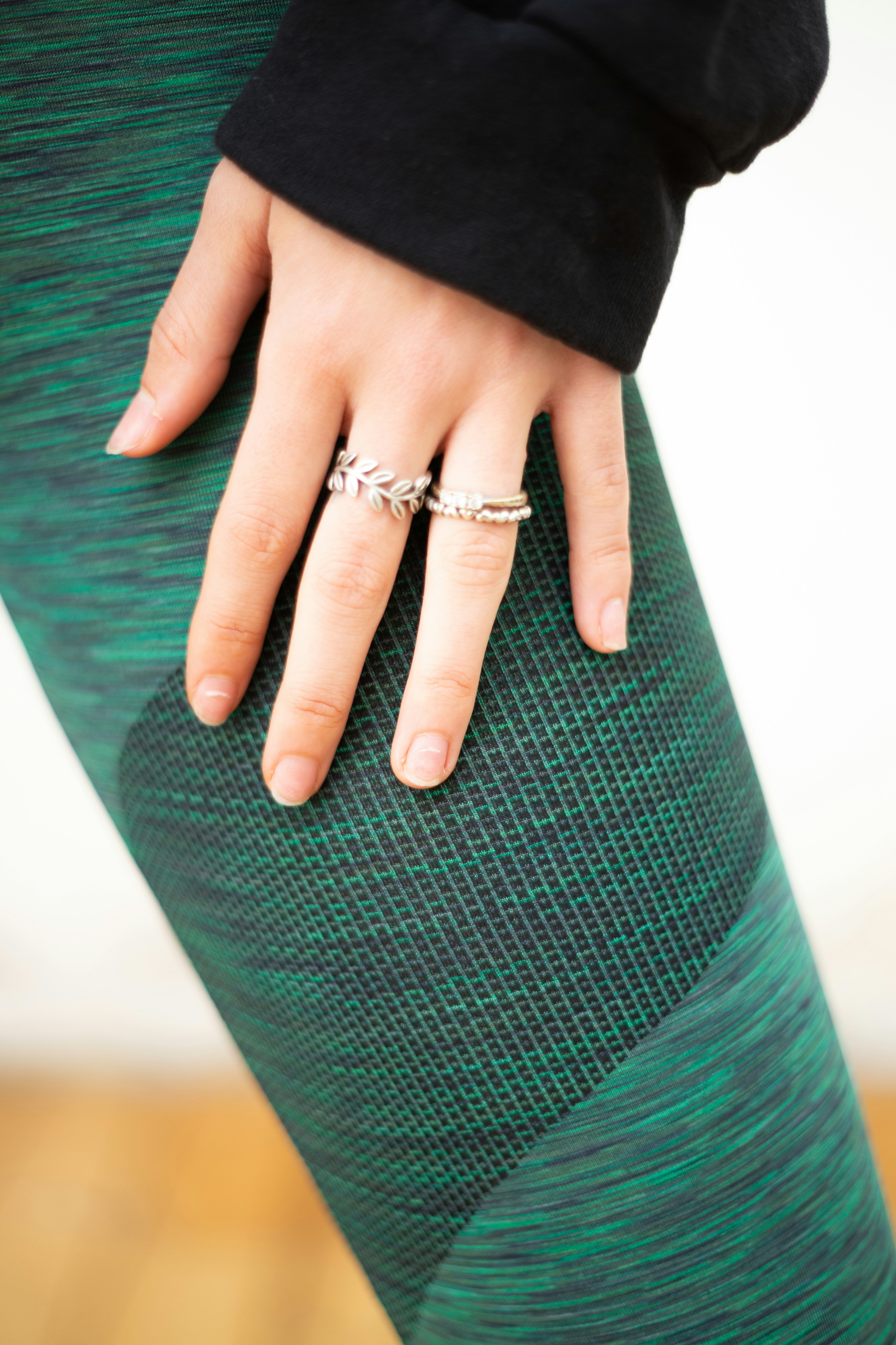 person wearing silver diamond ring